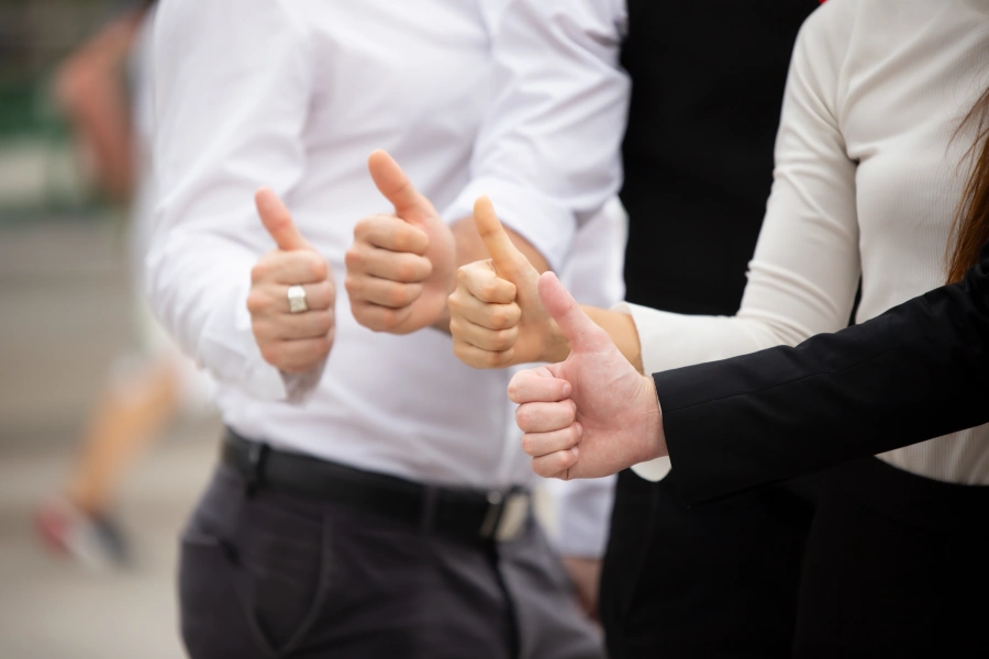 business-team-touching-hands-together-after-tradewatchseo
