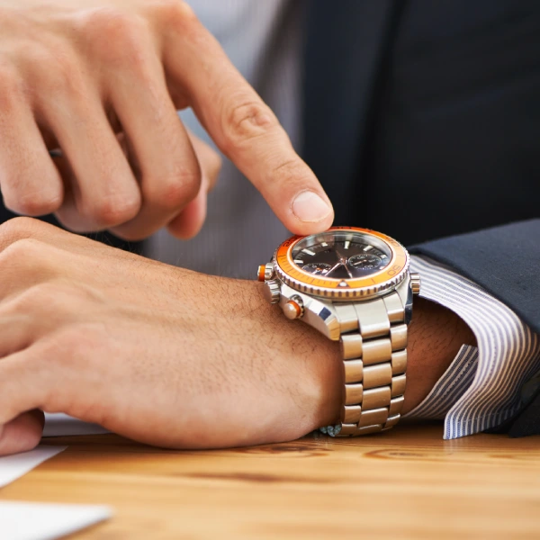 cropped-shot-of-a-businessman-checking-the-time-on-2025-04-06-07-22-07-utc
